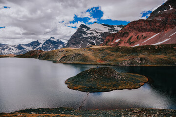 Scenic view from a natural reservation with tremendous mountains and a lake in Gran Paradiso, Italy