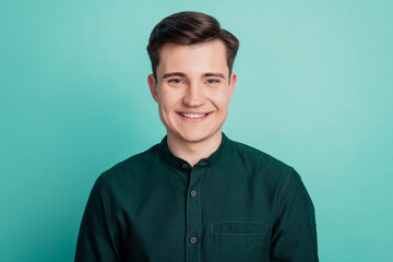 Fototapeta premium Photo of young business man employer smiling isolated turquoise background