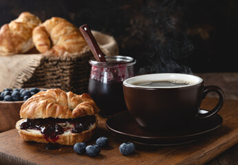 Croisant With Blueberry Jam and Cup of Coffee