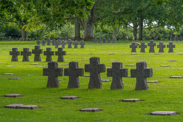 Naklejka premium La Cambe, France - 08 03 2021: Normandy German military cemetery and Memorial and the black crosses