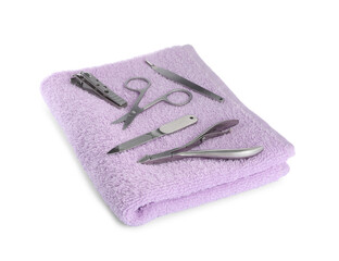 Manicure set on soft towel, white background
