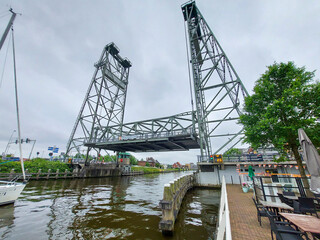 Obraz premium Steel lift bridge over the Gouwe at Waddinxveen open for high-masted ships