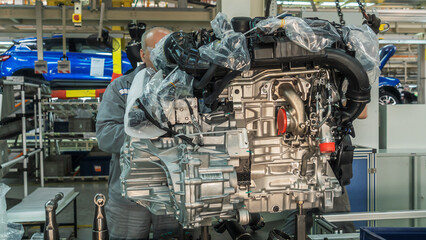 The engine on tray in the car factory. Newly manufactured engine on the production line in a factory concept. Industrial concept.