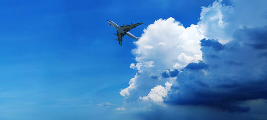 Airplane in the sky at sunrise or sunset