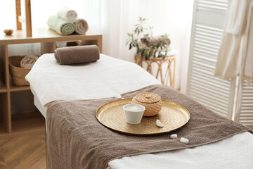 Stylish room interior with massage table in spa salon