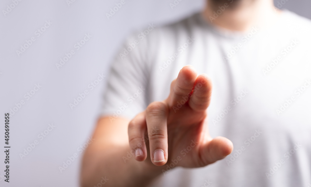 Poster hand pushing on a touch screen..