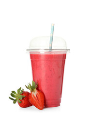 Delicious smoothie with straw in plastic cup and fresh strawberries on white background