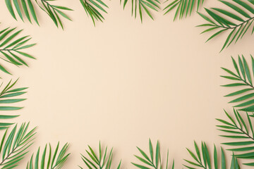 Fototapeta na wymiar Pastel beige background with palm leaves. Flat lay, copy space.