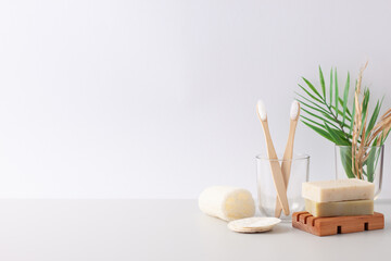 Zero waste, sustainable and eco-friendly lifestyle. Soap, toothbrush with palm on white background....