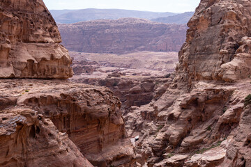 View of the mountain canyon in Wadi Rum. The city of Petra. Historical and archaeological city in southern Jordan. Red mountains against the blue sky.