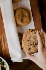 Woman Grabbing a Freshly Baked Cookie