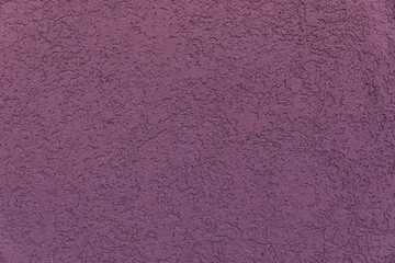 The texture of the wall is dark mauve color