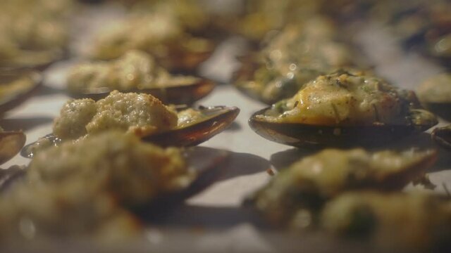 Baked stuffed fresh mussels in shell.