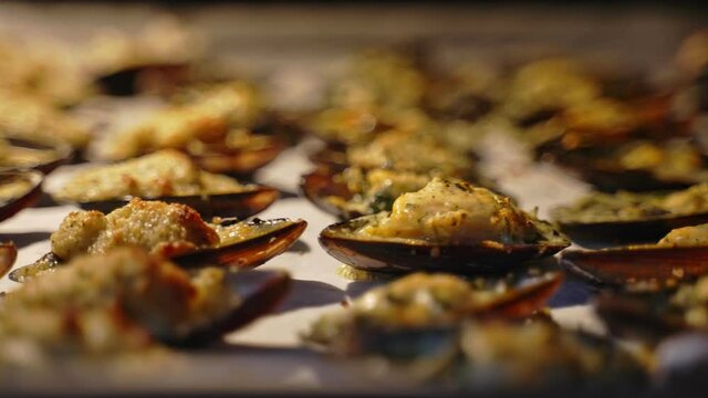 Baked stuffed fresh mussels in shell.