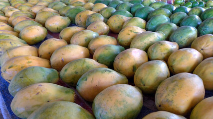 Papaya stand on the market - papaya fruit