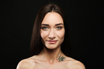 Fototapeta premium Portrait of pretty young woman with gorgeous chestnut hair on black background