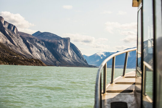 View of mountains and fjord from a boat, Baffin Island.