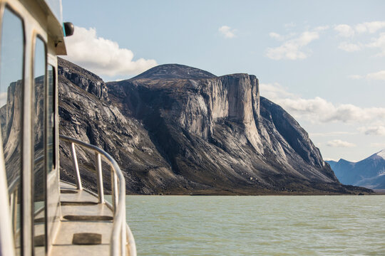View of rugged remote mountains on Baffin Island from boat.