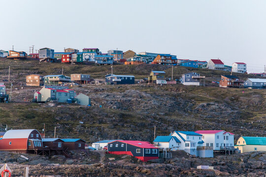 Houses perched on cliffs in the city of iqaluit, Canada.