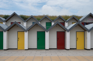 Fototapeta na wymiar Colourful new beach huts