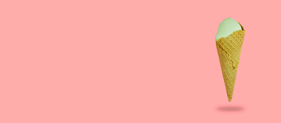 banner with ice cream cone on the side. waffle cone with pistachio ice cream