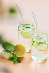 Sassi water. Detox drink with lemon, cucumber, ginger and mint. Healthy food concept. Glass straws