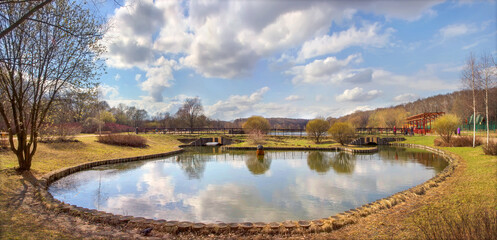 Panoramic photo of picturesque pond in Terletsky park. Moscow, Russia