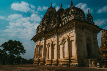 Scenic view of a temple of Khajuraho on blue sky background in India
