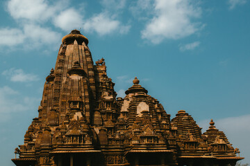 Scenic view of  a temple of Khajuraho on blue sky background in India
