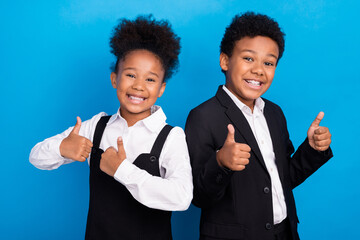 Photo of small little dark skin friends people pupils wear uniform formalwear thumbs up isolated on blue color background