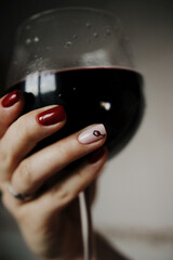 glass of wine and manicure