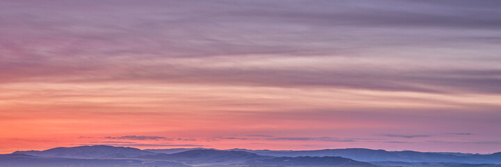 colorful sky over Yampa River valley at dawn near Dinosaur National Monument in north western Colorado, panoramic web banner