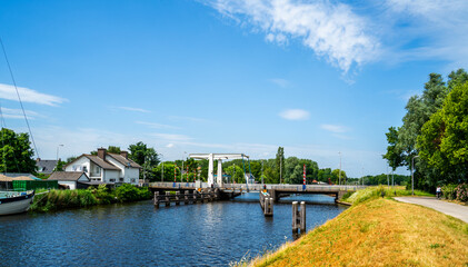 Fototapeta na wymiar Dutch landscape with bridge over the river Eem 