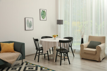 Dining table with chairs in living room. Interior design
