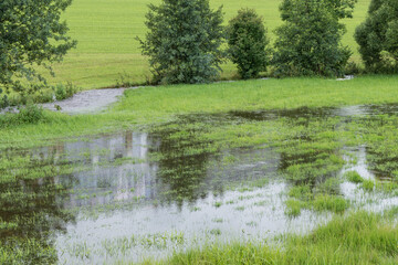 Flooding by a stream