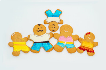 Happy family of gingerbread men, parents and three children.