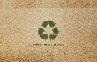 Reduce reuse recycle (3Rs rule). Recycle sign on cardboard. Brown paper background.