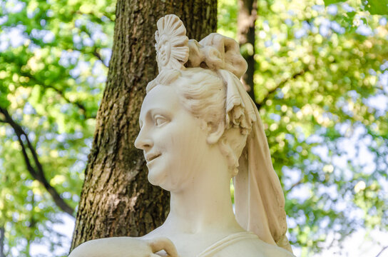 Antique marble sculptures in the park in summer.