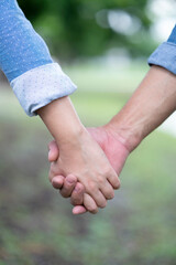 Lovers couple holding hands between boyfriend and girlfriend, love and romance concept