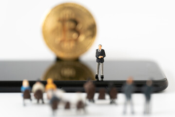 Miniature people Businessman speech presentation on podium on public stage with Golden Bitcoin background Success Strategy Business Planning and New Blockchain Technology Money transfer concepts