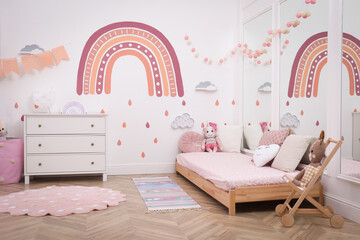 Montessori bedroom interior with floor bed and toys