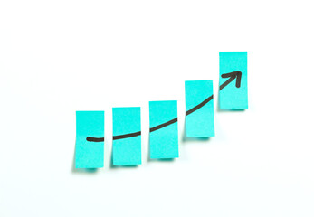 adhesive sticky notes with growing rising business graph