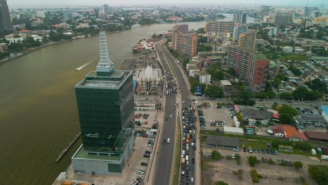 Traffic and cityscape of Falomo Bridge, Lagos Law school and the Civic centre tower in Lagos Nigeria
