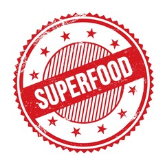 SUPERFOOD text written on red grungy round stamp.