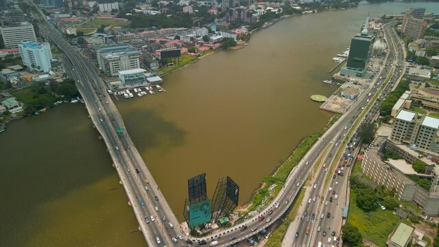 Traffic and cityscape of Victoria Island, Lagos, Nigeria featuring Falomo Bridge, Lagos Law school and the Civic centre tower