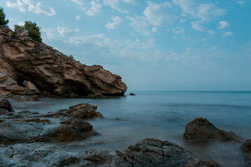 Rocks On Seashore Against Blue Sky in Spain