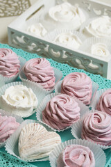 Homemade marshmallows of various colors and flavors. Lies on a tray. Close-up shot.