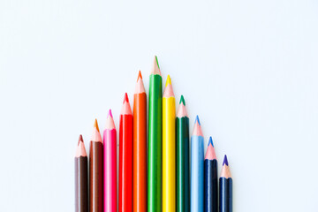colored pencils in the center of the white background