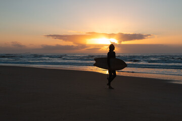 Surf beach surfing Sunset sunrise beach sand sea background walking silhouette