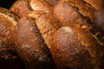 Freshly baked hot loaves of crispy artisan bread close-up. Healthy foods and proper nutrition